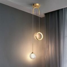 two lights hanging from the ceiling in a room