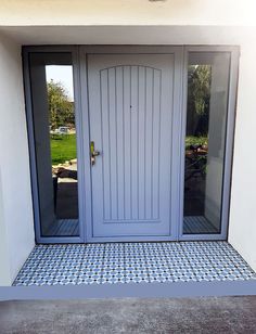 the front door to a house with tiled flooring