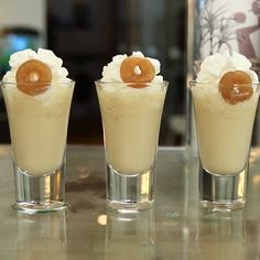 three shot glasses filled with ice cream and caramel