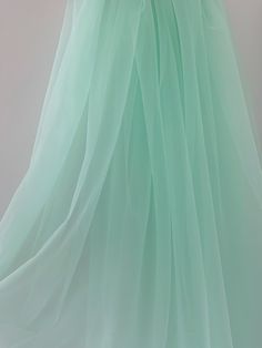 Wedding Dress With Sheer Back In Tulle, Wedding Tulle Dress With Sheer Back, Floor-length Organza Tulle For Wedding, Green Sheer Dress For Wedding, Sheer Green Dress For Wedding, Stretch Tulle Fabric For Party, Green Sheer Tulle Dress, Elegant Floor-length Tulle Skirt, Sheer Tulle Dress For Debutante Ball