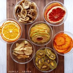 six plastic bowls filled with different types of fruits and vegetables on top of a wooden table