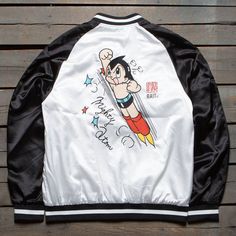 BAIT x Astro Boy Men Mighty Atom Souvenir Jacket (black / white) $139.99 White Retro Varsity Jacket With Letter Print, Retro White Varsity Jacket With Letter Print, White Outerwear With Graphic Print And Baseball Collar, Urban White Varsity Jacket With Graphic Print, White Urban Varsity Jacket With Graphic Print, White College Varsity Jacket With Graphic Print, College White Varsity Jacket With Graphic Print, White Varsity Jacket With Graphic Print For College, White Varsity Jacket With Graphic Print