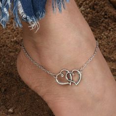 We Are In Love With This Adorable Antiqued Finished Anklet. Featuring Two Interlocked Hearts Nestled In The Center Of An Adjustable Silver Chain, This Anklet Will Be A Favorite. Anklet Measures 8.66" With A 1.6" Extender To Adjust Size. Trendy Adjustable Heart-shaped Anklets, Trendy Heart-shaped Anklets For Valentine's Day, Trendy Anklets For Valentine's Day, Trendy Adjustable Heart Anklets, Adjustable Heart-shaped Anklets For Valentine's Day, Casual Silver Anklets For Gifting, Casual Silver Anklets As Gift, Casual Silver Anklets For Gifts, Heart-shaped Anklets For Valentine's Day