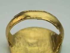 For Sale on 1stDibs - An Ancient Head of Medusa Gold Ring circa 300 BC This high carat gold Hellenistic ring is designed as a gold disc with a horizontally positioned archaic Antique Gold Dome Ring With Polished Finish, Ancient Style Collectible Yellow Gold Rings, Gold Vintage Jewelry For Formal Occasions, Ancient Gold Collectible Rings, Gold Ancient Style Signet Ring For Ceremonial Use, Ancient Gold Engraved Signet Ring, Ancient Style Engraved Gold Signet Ring, Antique Gold Dome Ring, Gold Engraved Etched Ring For Ceremonial Use