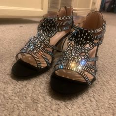 It’s Brand New Never Been Worn Before Size 9 Bling Heels For Night Out With Round Toe, Night Out Heels With Bling, Bedazzled Round Toe Evening Heels, Bedazzled Round Toe Heels For Evening, Bedazzled Heels With Round Toe For Evening, Black Bedazzled Heels For Formal Occasions, Black Bedazzled Open Toe Heels, Black Low Heel Heels With Rhinestones, Black Bedazzled Evening Heels