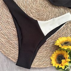 Indulge in timeless elegance with our Black and White Wonder Push-Up Bikini. This classic beach style offers a perfect balance of sophistication and allure. Crafted with durable and comfortable nylon and Terylene, and featuring a solid pattern, it offers a touch of simplicity and versatility. The padded cups and wire-free design ensure a comfortable fit that flatters your figure. Complete your beach or poolside ensemble with the low waist bottom. Designed by Thekittenpark Female Swimwear, Middle Age Fashion, Beach Swimwear, Linen Pants Women, Womens Bathing Suits, Womens Dress Pants, Sorrento, Swim Suit, Beach Style