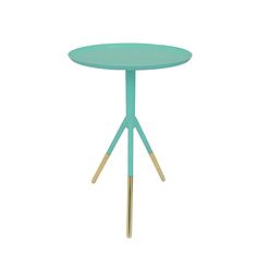 a blue table with gold legs and a white background