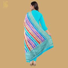 Get the celebration mood on with designer dupatta. Coming exclusively from the fine craftsmen of Banaras city is this gorgeous piece of art in the form of georgette dupatta. Having these handwoven Banarasi dupattas would add to your wardrobe. Fabric - Pure Georgette Silk Georgette is a light-weight, crinkled and sheer fabric, displaying an overall bouncy look. A strong absorbent, Georgette is easy to dye and has dull-rough texture. Georgette is made from twisting yarns of silk. Weave – Stripes C Multicolor Anarkali Traditional Wear With Sheer Dupatta, Multicolor Semi-stitched Jamawar Dupatta, Multicolor Anarkali Traditional Silk Wear, Multicolor Anarkali Silk Traditional Wear, Multicolor Handloom Tussar Silk Salwar Kameez, Festive Multicolor Silk Scarf, Multicolor Handloom Chanderi Dupatta, Multicolor Art Silk Unstitched Suit With Dupatta, Multicolor Silk Unstitched Suit With Traditional Drape