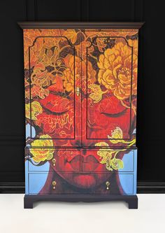 a cabinet with flowers painted on it