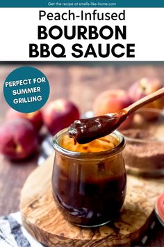 a spoon full of bbq sauce sitting on top of a cutting board next to apples