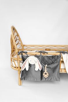 a baby crib with a stuffed animal in it