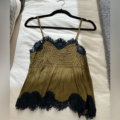 Urban Outfitters Betty Smocked Cami Top Size: S Never Worn, Nwt! Smock-Style Cami Top With A Lightweight Fabrication And Woven Criss-Cross Finish. Sleeveless Silhouette Ft. A Sweetheart Neck, Adjustable Spaghetti Straps, Empire Waist And Contrast Lace Trims Lace Cami Top, Lace Trims, Lace Cami, Urban Outfitters Tops, Sweetheart Neck, Cami Top, Cami Tops, Empire Waist, Criss Cross