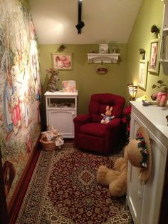 a child's room with a red chair and teddy bear on the rug in it