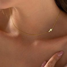 14K GOLD Sideways Cross Necklace Introducing the Tiny Gold Cross Choker, the most charming cross choker you'll find. Ideal as a special treat for yourself or a thoughtful gift for others, this delicate piece is sure to add a touch of beauty to any occasion. Crafted with love, this personalized handmade jewelry is a genuine showcase of quality and beauty--an ideal gift for your loved one with a 2 year warranty. Product Details *  Cross is off-centered to the left side unless requested to be cente Cross Necklace Gold, Necklace Gold Pendant, Sideways Cross Necklace, Cross Necklace Sideways, Cross Choker, Gold Cross Necklace, Color Inspo, Gold Cross, Minimalist Necklace