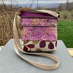 "Vegan crossbody or shoulder bag makes a wonderful everyday bag. Textured Upholstery Tapestry looks Handwoven..Industrial Strength Upholstery Tapestry accented with Batik . This bag is loaded with pockets! The outside has one deep zipper, one shallow(for your phone?)zipper, and one deep open pocket. Top zip opens to roomy interior with 4 more smaller pockets. Inside fits an iPad mini. Strap is sturdy web material and adjustable to shoulder bag or crossbody length. Great as a travel purse-very li Purple Crossbody Bag With Zipper Pocket, Fabric Bag With Cell Phone Pocket For Everyday Use, Fabric Bags With Cell Phone Pocket For Everyday Use, Travel Fabric Bag With Zipper Pouch, Fabric Crossbody Travel Bag, Rectangular Purple Shoulder Bag With Zipper Pouch, Purple Rectangular Shoulder Bag With Zipper Pouch, Fabric Crossbody Shoulder Bag For Daily Use, Fabric Crossbody Bag With Adjustable Strap