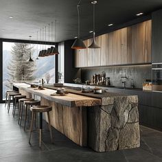 a large kitchen with an island counter and bar stools next to the window that looks out onto the mountains