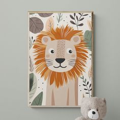 a teddy bear sitting next to a painting of a lion