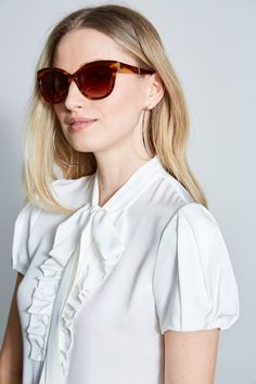 These chic oversized sunglasses feature a slight cat eye shape and are 100% UV protected. Perfect for sunny days, you will reach for these Sunglasses all season long. A hard case & cleaning cloth are included. Style #: EL123 Elegant White Cat Eye Sunglasses With Uva Protection, Elegant Polarized Cat Eye Sunglasses For Day Out, Elegant Sunglasses With Uv Protection For Summer, Elegant Cat Eye Sunglasses For Day Out, Feminine Tinted Sunglasses For Spring, Elegant Sunglasses With Uv Protection For Day Out, Elegant Polarized Sunglasses For Summer, Chic White Cat Eye Sunglasses In Acetate, Elegant Sunglasses With Gradient Lenses For Day Out