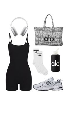 a woman's outfit with headphones, sneakers and an adidas bag