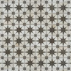 an image of a star pattern in brown and white colors on a tile wall or floor