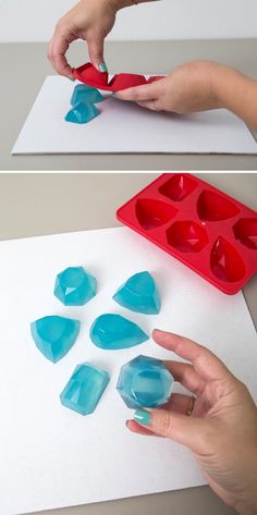 someone is making heart shaped ice trays with blue and red icing on them