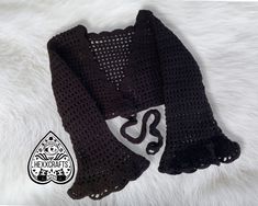 Step into the world of gothic enchantment with our Handmade Bell Sleeve Crochet Shrug, designed for those who love a witchy aesthetic. Perfect for Halloween and the fall season, this black bell sleeve shrug adds a mystical touch to any outfit. Crafted with care from high-quality acrylic yarn, this shrug is a must-have for gothic enthusiasts. 🖤 Gothic Charm: Embrace your inner witch with this stunning bell sleeve shrug, perfect for gothic and witchy fashion enthusiasts. 🌙 Witchy Aesthetic: Ideal for Halloween, autumn festivals, or adding a touch of magic to your everyday wardrobe. 🧶 Handmade Excellence: Each shrug is crocheted by hand, ensuring superior quality and intricate detailing. 🎃 Comfort and Style: Lightweight yet cozy, this shrug is great for layering and keeping warm while loo Witchy Crochet, Black Crochet Cardigan, Halloween Rave, Aesthetic Sweaters, Inner Witch, Sleeve Shrug, Witchy Aesthetic, Crochet Cozy, Crochet Bunny Pattern