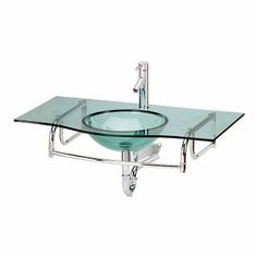 a bathroom sink with a glass bowl and chrome faucet on the bottom shelf