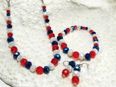 This is the perfect jewelry set for the 4th of July.  It makes a nice gift for someone special for the 4th.  The beads are faucet cut - red, blue and frosted white. They range from 4mm to 12mm in size.  The necklace is 18 inches with a silver chain and lobster claw closure.  The bracelet is 7.5 inches long and the earrings have a 1 inch drop. Patriotic Blue Round Bead Jewelry, Patriotic White Jewelry With Colorful Beads, Patriotic Jewelry With Colorful Beads As Gift, Patriotic Colorful Beaded Jewelry Gift, Patriotic Round Beads Jewelry Gift, Red Patriotic Jewelry For Independence Day, Red Jewelry For 4th Of July Gift, Multicolor Round Beads Jewelry For Independence Day, White Beaded Jewelry For Independence Day