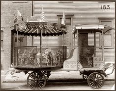 an old photo of a horse drawn carriage