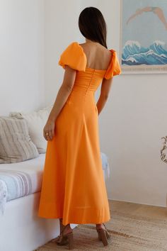 Get kissed by the sun on your next holiday in the Feeling Tanned Maxi Dress in Orange. This flowy dress is designed to follow you as you stroll around in the hot summer and clear skies kind of weather. Pair with loose waves and sandals. Maxi dress. true to size V neckline Knot bust design with keyhole Puff short-sleeves Invisible back zipper Soft pleats throughout dress Semi-lined 45% Cotton 55% Linen. Lining: Rayon Non-stretch Please refer to the care label on your garment for specific instructions on how to care for it Model wears XS Length from shoulder to hem: 130cm on an S Chest 34cm. Waist 30cm. size S Summer A-line Maxi Dress For Beach Season, Flowy A-line Sundress For Vacation, Flowy A-line Summer Sundress, Casual Ruched Sundress For Beach, Spring Midi Dress For Summer Parties, Breezy Fitted Sundress For Beach, Casual Ruched Maxi Dress For Beach Season, Orange Sundress For Summer Brunch, Flowy Sundress For Brunch And Vacation