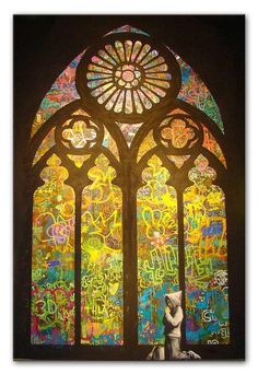 an image of a stained glass window with graffiti all over it