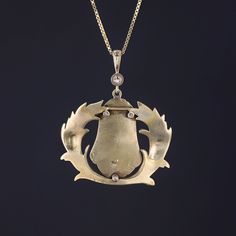 This 14k gold pendant features a pharaoh adorned with glittery diamond accents. The pendant was originally an antique brooch (circa 1910) that our jeweler transformed by removing the pin findings and adding a diamond surmount and 14k gold bail. The pendant measures 1.5 inches from the top of the bail to bottom by 1.25 inches wide, and it is in great condition. We are providing the option to purchase the pendant with or without the 18 inch, 14k gold chain depicted in the photo. Note: The antique Gold Diamond Brooch Jewelry, Gold Pendant Necklace With Brooch, Antique Style Necklaces For Anniversary, Gold Diamond Jewelry With Brooch, Antique Diamond Jewelry For Ceremonial Occasions, Antique Necklaces With Diamond Accents, Victorian Gold Jewelry With Diamond Accents, Gold Diamond Jewelry In Art Deco Style, Art Deco Diamond Gold Jewelry