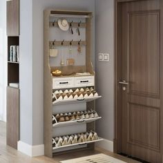 a wooden shoe rack with several pairs of shoes on it in a room next to a door