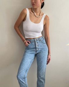 Vintage guess jeans featuring iconic exposed button fly and soft faded light wash cotton denim.  with high rise slim curvy fit natural fade and tapered leg.    waist 27  rise 12  hips 39  inseam 31  flat at thigh 11.5 at ankle 6.5    1980s/1990s guess jeans george marciano made in usa tagged size 29    excellent vintage condition.  model is 5'10 size 2/4    sh 107 Black Tank Dress, Black Aviators, Neon Purple, Vintage Studio, Boyfriend Tee, Light Wash Jeans, Engineered Garments, Guess Jeans, Ruched Dress