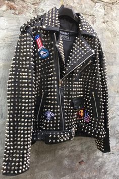 Material: Studded Jacket made with 100 % Genuine Top Quality Cowhide Leather Polyester Inner Lining & inside Pocket Long Spiked and Studded Used Each Single one is Punched with hands High Quality Spikes & Studs. Each securely added by hand Cropped, Vintage 0.9 to 1.0 MM Cowhide Leather used Zipper details on Sleeves Soft Black Real Leather Color: Black Studded Jacket, Black Leather Jacket, Workout Jacket, Winter Casual, Soft Black, Silver Studs, Punk Rock, Cowhide Leather, Real Leather