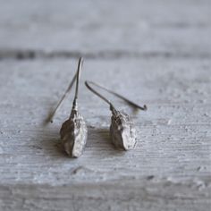 Nature earrings -Sterling silver dangle earrings -Cardamom earrings-Botanical jewelry -Nature jewelry -Gift for her -Gift for chef or cooks Sterling silver cardamom pod earrings nature cast from a real cardamom using the lost wax method. The cardamom soldered in Sterling silver wire hook and has matte finish. Material: Sterling silver Cardamom pod size : 2cm Total length:4cm Please note that every piece you purchase from cyklu is unique and handmade by me. You can make it yours or turn it into g Nature-inspired Single Earring As A Gift, Nature-inspired Single Earring As Gift, Single Earring Nature-inspired Jewelry As Gift, Nature-inspired Hypoallergenic Dangle Earrings, Unique Long Drop Linear Earrings For Gift, Unique Linear Drop Earrings Gift, Unique Linear Drop Earrings For Gift, Handmade Sterling Silver Linear Earrings Gift, Handmade Sterling Silver Linear Earrings For Gifts