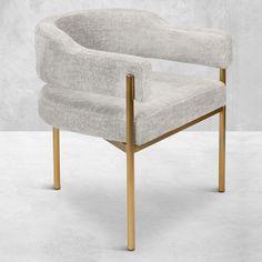 an upholstered chair with wooden legs in grey fabric