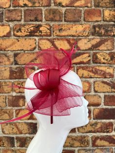 Beautiful wine red bow shape fascinator with crimped loops and feathers This fascinator is in a pretty bow shape consisting of crimped loops and decorative feathers. It can be worn as a headband or a clip which can both be slid onto the underside of the fascinator through an elastic attachment that keeps the headpiece securely in place.  Both the clip and matching colour headband are supplied. Fascinator measures at 24x15cm Other colours are available in my Etsy shop Fascinator Headband, Elegant Dresses For Women, Red Bow, Wine Red, Ornament Wreath, Other Colors, Elegant Dresses, Sewing Hacks, Color Matching