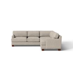 a sectional couch with chaise lounger and footstool in beige fabric on an isolated white background