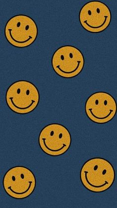 many smiley faces are shown on a blue background