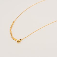 A delightfully modern take on charm jewelry, this dainty necklace features geometric rectangular charms that dance along a fine chain. The minimalist design creates a subtle sparkle around the neckline, perfect for everyday elegance. Specifications: Finish: 18K gold platedCore: Titanium steelSize: 39.5 cm chain + 5 cm extenderClosure: Lobster clasp Dainty Necklace With Delicate Chain And Rectangular Pendant, Gold Plated Delicate Chain Necklace With Rectangular Pendant, Gold Rectangular Minimalist Charm Necklace, Dainty Gold-tone Necklace With Lobster Clasp, Minimalist Gold-tone Chain Necklace With Lobster Clasp, Everyday Elegance, Dainty Necklace, Charm Jewelry, Lobster Clasp