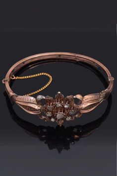 "Step into the Victorian era with this 10K Gold Rose Cut Diamond Hinged Bangle Bracelet. Its 0.91 TCW diamond offers a delicate sparkle, while the timeless design captures the beauty of the past. A perfect treasure for antique collectors. #VintageJewelry #AntiqueBracelet #VictorianEra" Luxury Handmade Antique Bracelets, Luxury Victorian Cuff Bracelet With Intricate Design, Luxury Antique Handmade Bracelets, Luxury Victorian Cuff Bracelet For Formal Occasions, Luxury Heirloom Cuff Bracelet For Formal Occasions, Luxury Ornate Cuff Bracelet For Ceremonial Use, Luxury Antique Gold Cuff Bracelet, Luxury Antique Cuff Bracelet With Intricate Design, Luxury Victorian Cuff Bracelet For Ceremonial Occasions