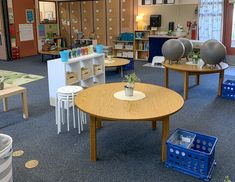 an empty library with tables and chairs in it