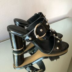 Rebecca Minkoff Women’s Chunky Heel Sandal | Black Patent Leather With Silver Detailing | Size 6.5 | Never Worn | Comes Without Shoe Box Party Mules With Buckle Closure And Open Heel, Black Low Heel Mules With Buckle Closure, Night Out Open Toe Sandals With Contrasting Heel, Party Mules With Buckle Closure And Round Toe, Night Out Mules With Stacked Heel And Round Toe, Round Toe Mules With Stacked Heel For Night Out, Round Toe Mules With Heel Strap For Night Out, Mules With Heel Strap For Night Out, Casual Party Heels With Buckle Closure