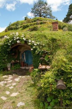 an image of a hobbot house in the grass