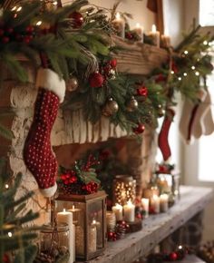 a mantel with candles and stockings on it