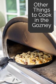 there is a cookie baking in the oven with words over it that read, other things to cook in the gozney