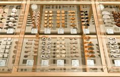 a display case filled with lots of different types of doughnuts