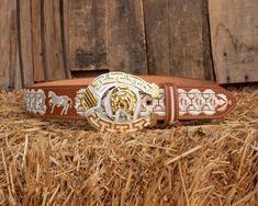 Unique handcrafted western leather belt with horse shoe design stitching and belt buckle Embroidered Leather Belt For Western-themed Events, Leather Embroidered Belt For Western-themed Events, Leather Belt With Embroidery For Western-themed Events, Western Brown Embroidered Belt, Embroidered Brown Belt Buckle For Rodeo, Brown Embroidered Belt Buckles For Western-themed Events, Western Concho Belts For Ranch, Western Style Belts For Rodeo, Western Belts And Suspenders For Ranch