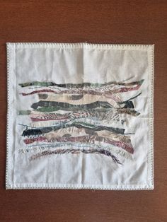 a piece of cloth with different colored fish on it